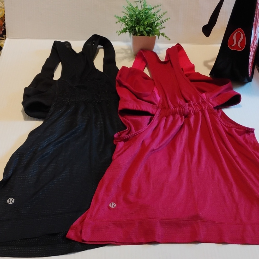 lululemon athletica Bundle. 2 Stash it Tank Tops. Women's size 6 Fuschia & Black